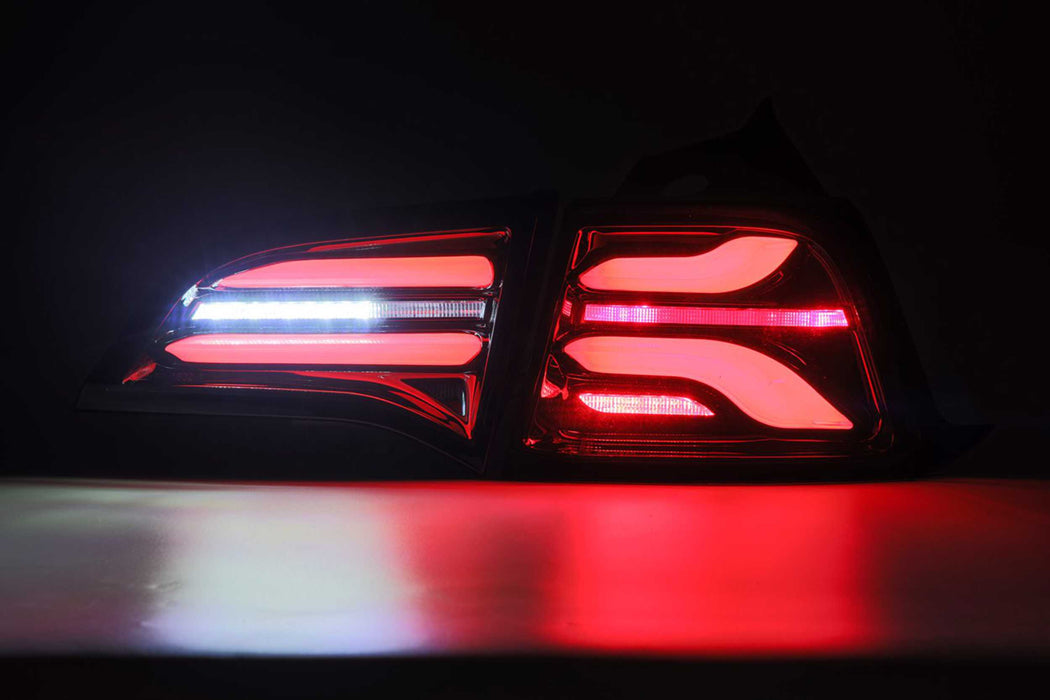 AlphaRex Pro LED Tails: Tesla Model 3 (17-22) / Model Y (w/ Red Turn Signals) (20-22) - Jet Black (SKU: 601010)